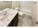 Bathroom with single vanity, bathtub, and toilet at 18471 W Ida Ln, Surprise, AZ 85387