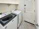 Laundry room with washer, dryer, and storage at 18471 W Ida Ln, Surprise, AZ 85387