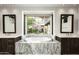 Luxurious bathroom with marble vanity and soaking tub at 20402 N 100Th Pl # 1326, Scottsdale, AZ 85255