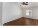 Simple bedroom with hardwood flooring and large window at 2706 S Ananea St, Mesa, AZ 85209