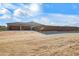 View of three-car garage and gated entry to the property at 28204 N Royce Rd, Queen Creek, AZ 85144