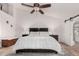 Relaxing bedroom with a king-size bed and ceiling fan at 2854 E Mallory St, Mesa, AZ 85213