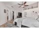 Bright bedroom with a king-size bed and access to a walk-in closet at 2854 E Mallory St, Mesa, AZ 85213