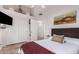 Comfortable bedroom with a queen-size bed and ample closet space at 2854 E Mallory St, Mesa, AZ 85213