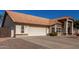 House exterior showcasing a two-car garage and desert landscaping at 2854 E Mallory St, Mesa, AZ 85213