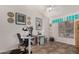 Bright home office features a standing desk, computer, and inspirational wall art at 2854 E Mallory St, Mesa, AZ 85213