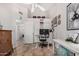 Spacious home office with built-in shelving and views into another room at 2854 E Mallory St, Mesa, AZ 85213