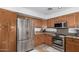 Well-equipped kitchen with stainless steel appliances and wood cabinets at 2854 E Mallory St, Mesa, AZ 85213