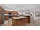 Modern kitchen with granite counters, stainless steel appliances, and island at 2854 E Mallory St, Mesa, AZ 85213
