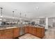 Open kitchen with island, granite countertops and stainless steel appliances at 2854 E Mallory St, Mesa, AZ 85213