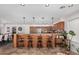 Kitchen features wood cabinets, granite countertops, and a breakfast bar at 2854 E Mallory St, Mesa, AZ 85213