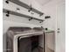 Laundry room with Samsung washer and dryer and stylish shelving at 2854 E Mallory St, Mesa, AZ 85213