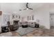 Relaxing living room with a fireplace, sectional sofa, and ceiling fan at 2854 E Mallory St, Mesa, AZ 85213