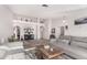 Open living area with a view into the kitchen and a cozy fireplace at 2854 E Mallory St, Mesa, AZ 85213