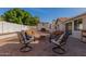 Outdoor patio with seating area and fire pit feature at 2854 E Mallory St, Mesa, AZ 85213