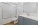 Updated bathroom with gray vanity and shower/tub combo at 3244 E Hononegh Dr, Phoenix, AZ 85050