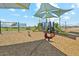 Modern playground with shade structures and play equipment at 37595 N Cowboy Ln, San Tan Valley, AZ 85140