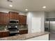 Modern kitchen with stainless steel appliances and granite countertops at 4380 W White Canyon Rd, San Tan Valley, AZ 85144