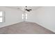 Well-lit bedroom featuring a ceiling fan and carpet at 4530 E Whitehall Dr, San Tan Valley, AZ 85140