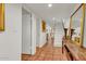 Long hallway with terracotta tile floors and a staircase at 4839 N 72Nd Way, Scottsdale, AZ 85251