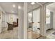 Light and airy hallway with mirrored closet doors and wicker chairs at 4839 N 72Nd Way, Scottsdale, AZ 85251