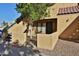 Exterior view of condo with stairs, gate, and small patio area at 4901 S Calle Los Cerros Dr # 153, Tempe, AZ 85282