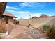 Backyard patio with rock landscaping and a wall at 5203 E Saguaro Cir, Phoenix, AZ 85044