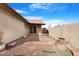 Small backyard with gravel, patio, and grill at 5203 E Saguaro Cir, Phoenix, AZ 85044