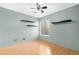 Bedroom with laminate wood floors and floating shelves at 5203 E Saguaro Cir, Phoenix, AZ 85044