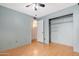 Bedroom with laminate floors and a large closet at 5203 E Saguaro Cir, Phoenix, AZ 85044