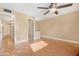 Spacious bedroom with tile floors and ceiling fan at 5203 E Saguaro Cir, Phoenix, AZ 85044