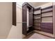 Large walk-in closet with shelving and hanging rods at 5203 E Saguaro Cir, Phoenix, AZ 85044
