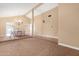 Spacious dining area with a chandelier and access to other rooms at 5203 E Saguaro Cir, Phoenix, AZ 85044
