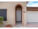 Ornate arched entryway with a decorative metal door at 5203 E Saguaro Cir, Phoenix, AZ 85044