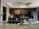 Modern kitchen with granite countertops and stainless steel appliances at 5203 E Saguaro Cir, Phoenix, AZ 85044
