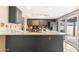 Updated kitchen, granite counters, island, and access to backyard at 5203 E Saguaro Cir, Phoenix, AZ 85044