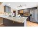 Modern kitchen with granite countertops and dark gray cabinets at 5203 E Saguaro Cir, Phoenix, AZ 85044