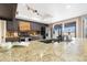 Kitchen features granite counters, modern appliances, and island at 5203 E Saguaro Cir, Phoenix, AZ 85044