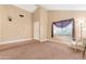 Spacious living room with a large window and neutral decor at 5203 E Saguaro Cir, Phoenix, AZ 85044