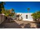 Backyard view with two orange trees and gravel at 5807 E Leonora St, Mesa, AZ 85215