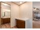 Bathroom has a vanity with a sink and a large mirror at 5807 E Leonora St, Mesa, AZ 85215