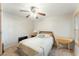 Cozy bedroom with a full-size bed and a drop-leaf table at 635 S 79Th Pl, Mesa, AZ 85208