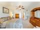 Bright bedroom with a queen-size bed and ample closet space at 635 S 79Th Pl, Mesa, AZ 85208