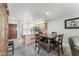 Dining area with a dark wood table and four chairs, near kitchen at 635 S 79Th Pl, Mesa, AZ 85208