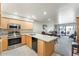 Modern kitchen with light wood cabinets and stainless steel appliances at 635 S 79Th Pl, Mesa, AZ 85208