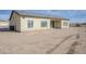 Rear view of house showing exterior and desert landscaping at 8197 W Pica Dr, Arizona City, AZ 85123