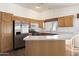 Kitchen featuring wood cabinets and stainless steel appliances at 825 N Sierra Vista Dr, Wickenburg, AZ 85390