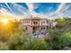 Luxury home with waterfall and pool; sunset view at 9749 N Fireridge Trl, Fountain Hills, AZ 85268