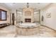 Luxurious bathroom with a large soaking tub, fireplace, and walk-in shower at 9749 N Fireridge Trl, Fountain Hills, AZ 85268