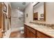 Bathroom with granite countertop, walk-in shower, and wood flooring at 9749 N Fireridge Trl, Fountain Hills, AZ 85268
